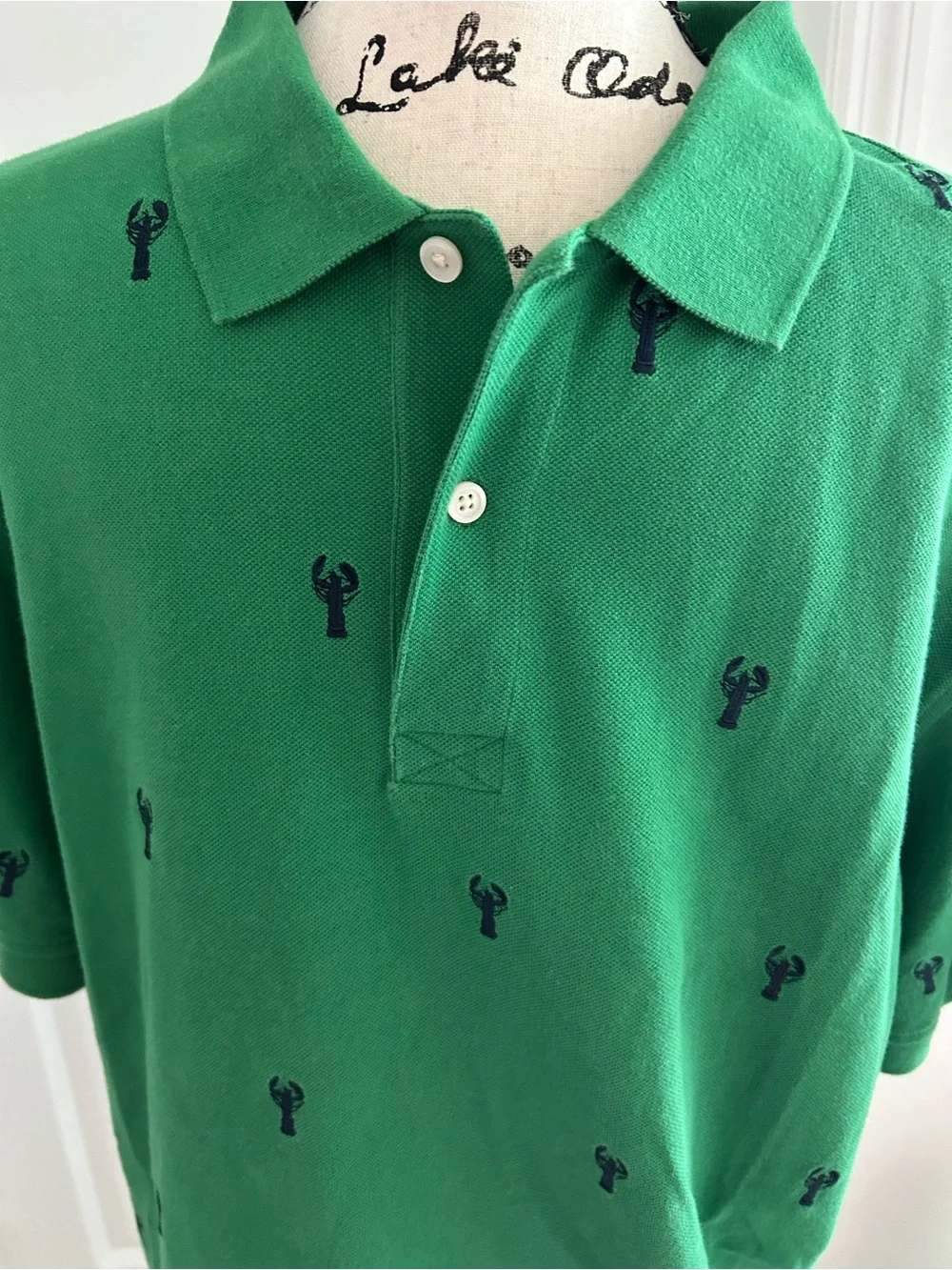 Green Polo Shirt with Navy Embroidered Lobsters. Size L